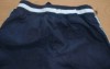 Tmavomodré šusťákové oteplené kalhoty s výšivkou a pruhy zn. St. Bernard