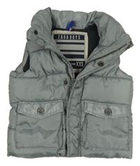 Šedá šusťáková zateplená vesta s kapsami 