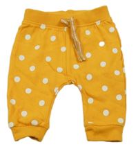 Pomerančové puntíkaté tepláky Ergee