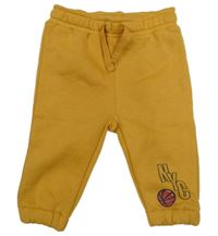 Okrové tepláky s míčem Primark