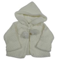 Bílý propínací svetr s bambulkami a kapucí 