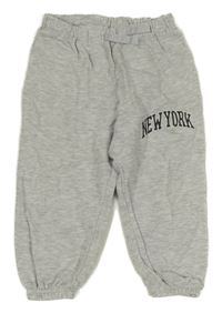 Světlešedé tepláky s nápisem H&M