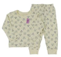 Nové - Smetanové pyžamo s medvídkem Pú Primark