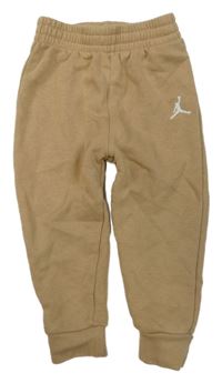 Béžové tepláky Nike Jordan 