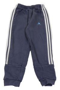 Tmavomodré tepláky s pruhy a logem Adidas