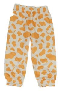 Bílo-oranžové vzorované tepláky 