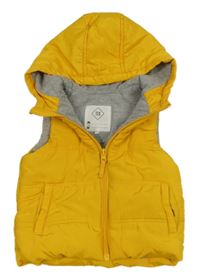 Žlutá šusťáková zateplená vesta s kapucí 