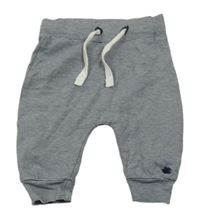 Tmavomodro-bílé proužkaté tepláky 