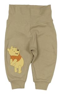 Béžové tepláky s medvídkem pú Disney