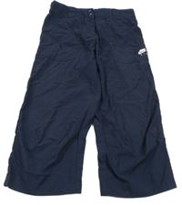 Tmavomodré capri šusťákové kalhoty s logem Nike