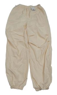 Nové - vanilkové šusťákové podšité kalhoty Primark