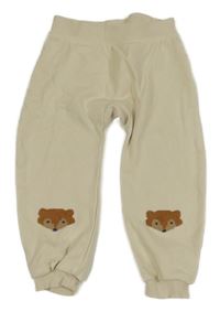 Smetanové tepláky s liškami lupilu