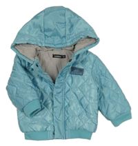 Světlemodrá šusťáková prošívaná zimní bunda s kapucí In Extenso