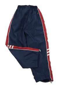 Tmavomodro-červené šusťákové podšité kalhoty s pruhy