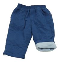 Tmavomodré šusťákové zateplené kalhoty