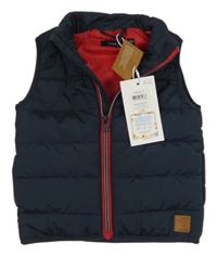 Nové - Tmavomodrá šusťáková prošívaná zateplená vesta Name it