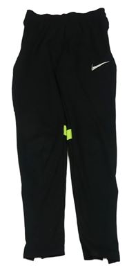 Černo-neonově zelené funkční sportovní tepláky s logem Nike 
