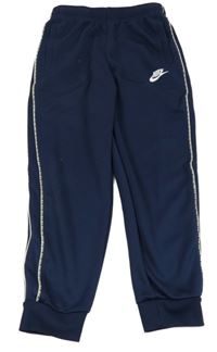 Tmavomodré sportovní tepláky s logem a pruhy Nike