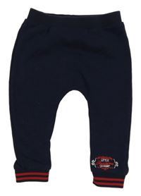 Tmavomodré tepláky s nápisem River Island