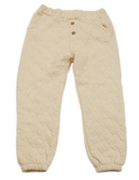 Meruňkové prošívané tepláky Next