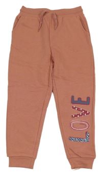 Starorůžové tepláky s nápisem Lupilu