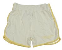 Smetanovo-žluté teplákové kraťasy s nápisy PRIMARK