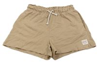 Béžové teplákové kraťasy s nášivkou zn. H&M