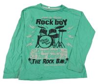 Zelené triko s bicí soupravou a nápisy Palomino