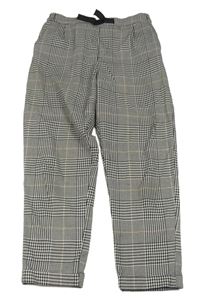 Bílo-černo-okrové kostkované teplákové kalhoty H&M