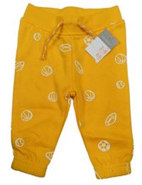 Nové - žluté tepláky s míči Primark