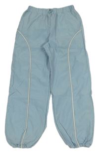 Světlemodré šusťákové kalhoty s proužkem Primark