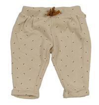 Béžové vzorované tepláky 