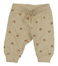 Béžové tepláky se srdíčky H&M