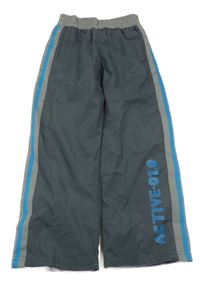 Tmavošedé šusťákové podšité kalhoty s nápisem Topolino