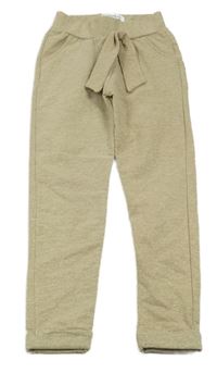 Béžové třpytivé tepláky s mašlí 