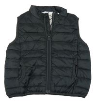 Černá šusťáková zateplená vesta Next