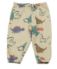 Béžové tepláky s dinosaury 