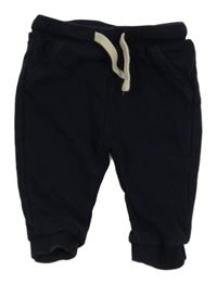 Tmavomodré tepláky KIABI