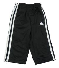 Černo-bílé sportovní tepláky s pruhy a logem Adidas