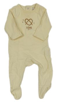 Smetanový overal s nápisem Kiabi