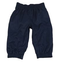 Tmavomodré šusťákové nepromokavé podšité kalhoty 