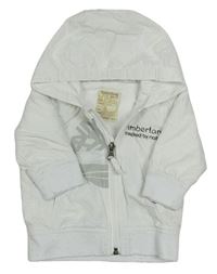 Bílá šusťáková jarní bunda s nápisem a kapucí Timberland