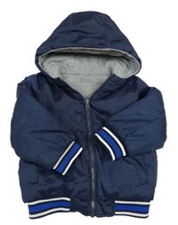 Tmavomodrá šusťáková zateplená oboustranná bunda s kapucí 