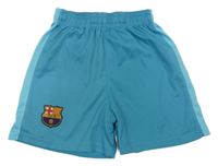 Světlemodré fotbalové kraťasy s erbem FC Barcelona
