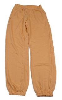 Světleoranžové tepláky Y.F.K.