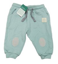 Nové - Světlezelené tepláky s nášivkou