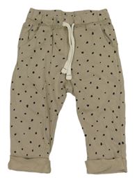 Béžové puntíkaté tepláky Lupilu