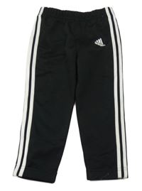 Černo-bílé sportovní tepláky s pruhy a logem Adidas