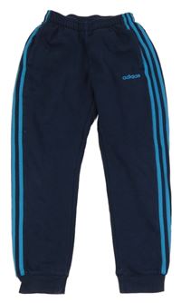 Tmavomodré tepláky s pruhy a logem Adidas