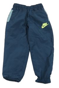 Petrolejové šusťákové sportovní kalhoty s logem Nike 